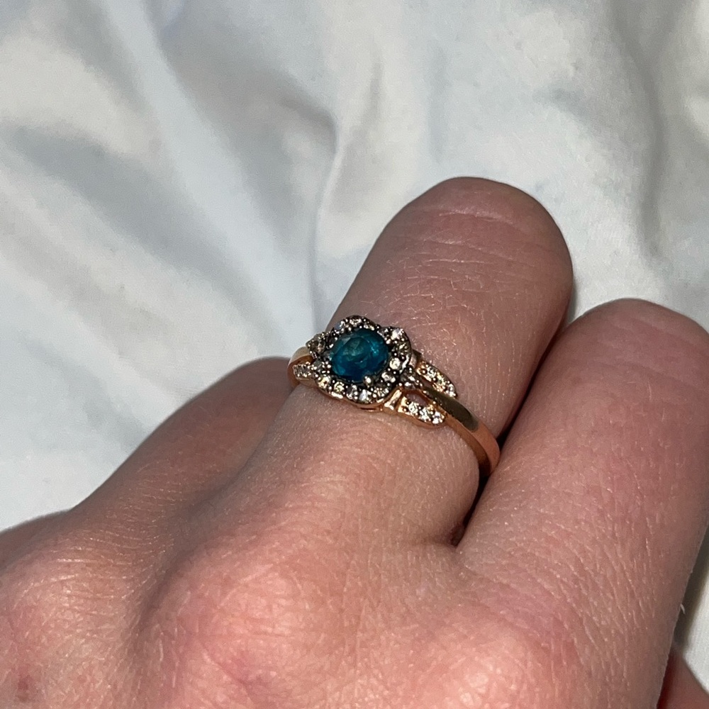 Gold Ring with Teal Blue Center Stone and Halo Accents